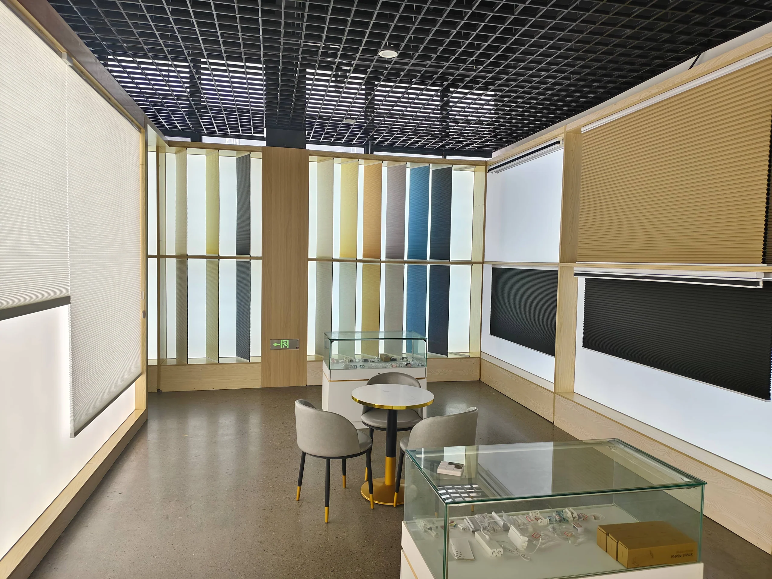CAIC showroom lounge surrounded by backlit honeycomb shade samples in many colours